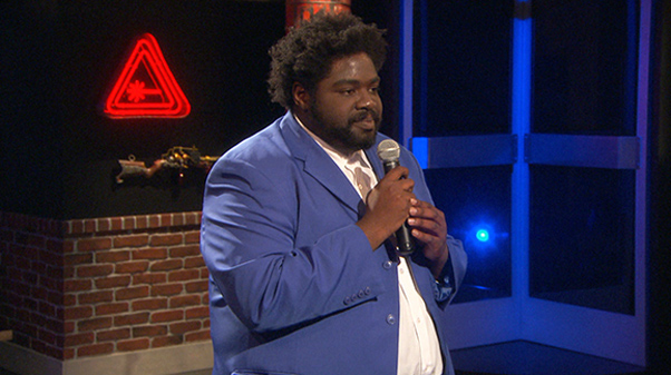 Ron Funches caught in the camera while performing on stage.ra while performing on stage.